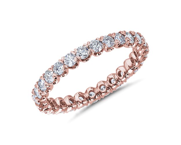 Elegantly romantic, this shimmering eternity ring features a unique v-prong pavé setting holding the diamonds secure. The lustrous gleam of the 14k white gold design speaks of enduring luxury.