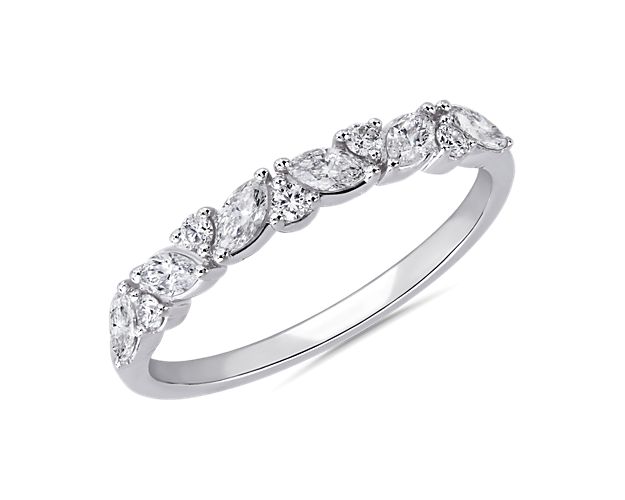 Marquise-cut diamonds nestle beautifully next to each other, creating a mesmerizing cluster along the front of this ring. It features classic 14k white gold design that promises lasting lustre and quality.