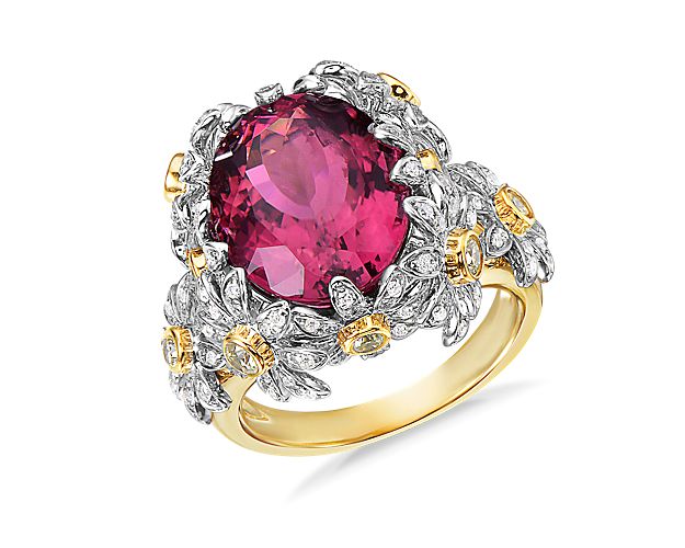 This truly unique ring features an oval rubellite tourmaline center stone adorned with diamond floral designs.  18k yellow and white gold come together to enhance the overall look.