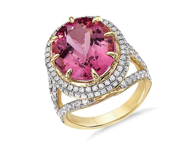 Pretty in pink, yes please!  This ring features a stunning pink tourmaline center stone surrounded by a double diamond halo and diamond detailing down the shank.  Set in luxurious 18k yellow gold, this ring is perfect for your next gift or self purchase.