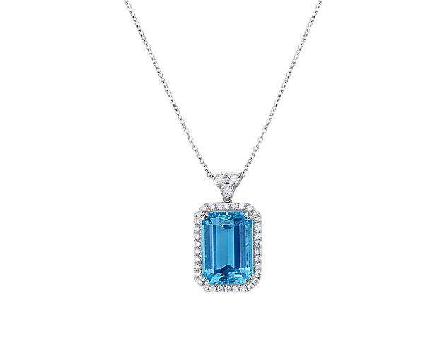 Catch their eye when you wear this gorgeous pendant set with a stunning emerald cut aquamarine stone featuring an alluring soft blue hue.  Surrounded by a halo of glistening diamonds, this pendant is a true showstopper.