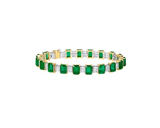 Emeralds and diamond baguettes come together perfectly to create this stunning bracelet.  Set in luxurious 18k yellow gold, this bracelet is truly a one-of-a-kind creation.