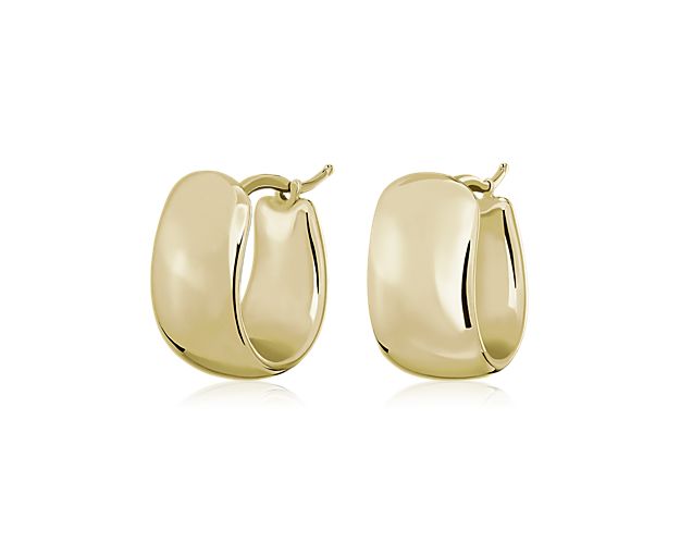 A thicker band makes these 14k Italian yellow gold huggies more of a statement piece than your average pair.