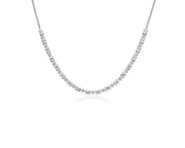 A beautifully crafted piece that mixes elegance with contemporary design, this 14k white gold necklace features three carats of round and oval-cut diamonds and is sure to turn heads.