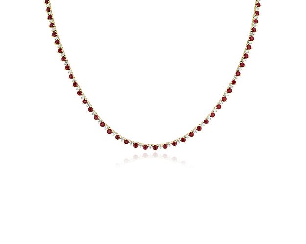 Complete your look with stunning sophistication when you wear this eternity necklace with round-cut rubies and diamonds alternating in a never-ending pattern. The warm lustre of the 14k yellow gold beautifully complements the regal red tones of the rubies.
