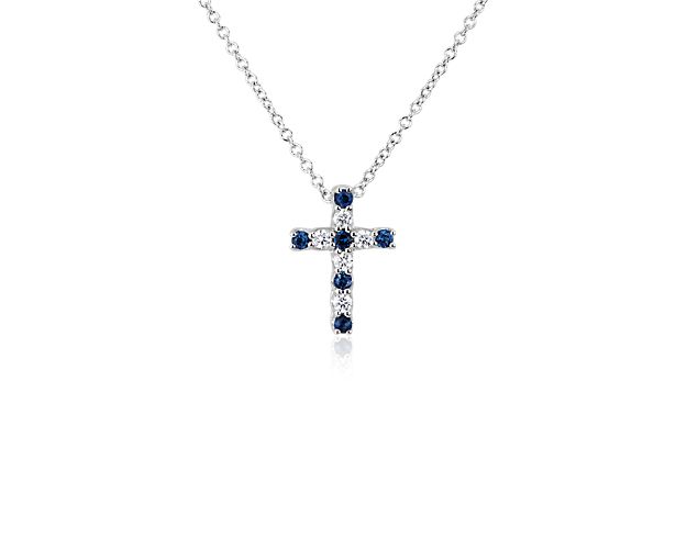 Wear a continual reminder of your faith with this elegant cross-shaped pendant set with alternating diamonds and sapphires for a stunning effect with plenty of sparkle. The 14k white gold design features a beautiful, bright lustre.
