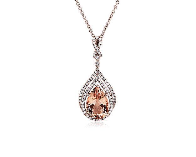 Tiered halos of diamonds delicately surround the pear-cut morganite stone at the heart of this elegant pendant, adding breath-taking sparkle. The warmly gleaming 14k rose gold design beautifully complements the rosy hue of the stone.