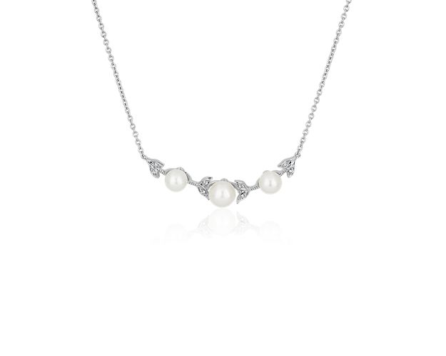 Bright pearls gleam beautifully from this necklace featuring a delicate drop design. The pearls are secured in stationary style to keep the necklace from shifting.