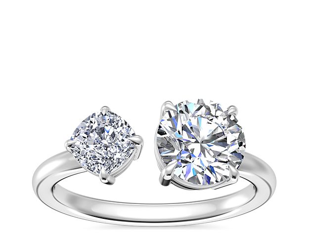 Let love shimmer with this engagement ring featuring a two-stone design, set with a cushion-cut diamond and a  round, princess, pear, asscher, emerald-cut, radiant, cushion, marquise, heart, or oval-cut stone. Count on the 14k white gold design to deliver lasting quality and a luxurious look.