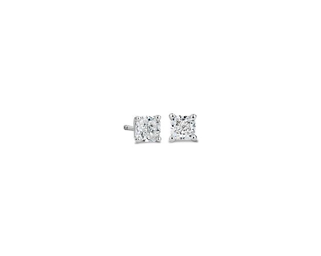 Timelessly classic, these stud earrings feature cushion-cut diamonds that shimmer brilliantly as they catch the light. Boasting 14k white gold settings, they promise luxurious quality that endures.