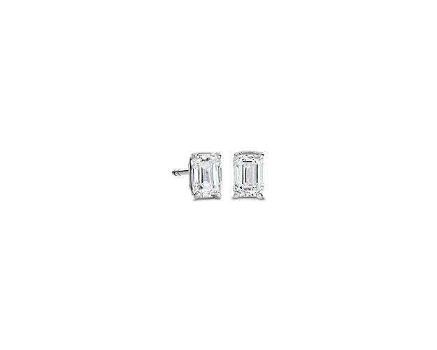 Infuse your ensemble with elegance as you wear these stud earrings set with bold emerald-cut diamonds that sparkle brilliantly. They are crafted from 14k white gold for a cool lustrous look and luxurious quality.