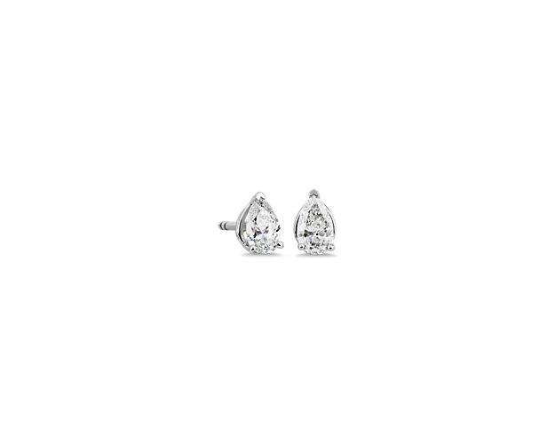Simple and sophisticated, these stud earrings are set with graceful pear-cut diamond that promise dramatic sparkle. They feature a cooly gleaming 14k white gold setting that promises enduring quality.