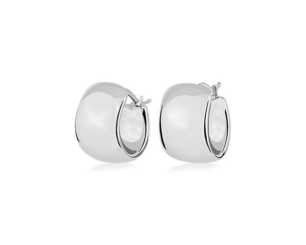 Elevate your look with these huggie hoop earrings featuring a bold wide design. The lustrous 14k white gold design gives them an eye-catching gleam.