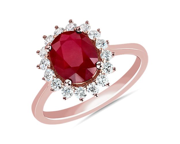 Oval Ruby and Diamond Sunburst Halo Ring in 14k Rose Gold (9x7mm)