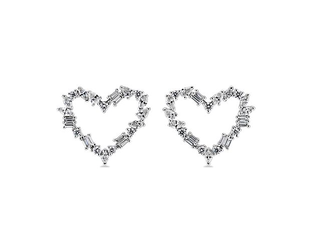 Infuse a touch of romance into your look when you wear these heart-shaped earrings, featuring gorgeous diamonds in alternating shapes sparkling along the outline of each heart. The 14k white gold design complements the look with a cool gleam.