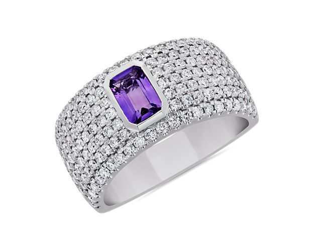 A bold emerald-cut purple amethyst sparkles at the heart of this ring, surrounded by beautifully delicate pavé-set diamonds. The wide 14k white gold design promises lasting lustre and quality.