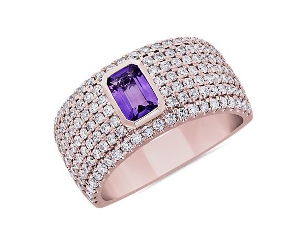 A bold emerald-cut purple amethyst sparkles at the heart of this ring, surrounded by beautifully delicate pavé-set diamonds. The wide 14k rose gold design promises lasting lustre and quality.