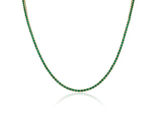 Brilliant emeralds glitter endlessly along this classic eternity necklace featuring a 17.5'' length. It features richly lustrous 14k yellow gold design for lasting quality.