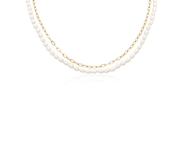 This double strand necklace features a paperclip chain and a freshwater pearl strand.  Connected by a lobster clasp, this necklace offers you the look of two necklaces in one.