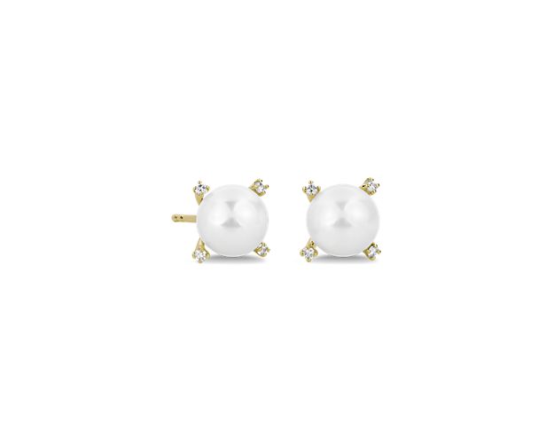 Crafted in 14k yellow gold, classic Akoya pearls are set with diamonds in these stunning earrings.