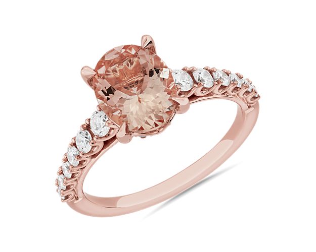 Warm 14k rose gold and a dreamy pink oval-cut morganite stone combine to make this ring a gorgeously romantic statement. Accent diamonds along the sides contribute brilliant sparkle in the light.