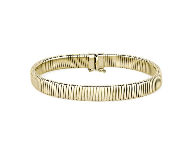 Accent your wrist with this elegant bracelet crafted from gorgeously lustrous 14k yellow gold. The ribbed texture gives it eye-catching detail as it catches the light.