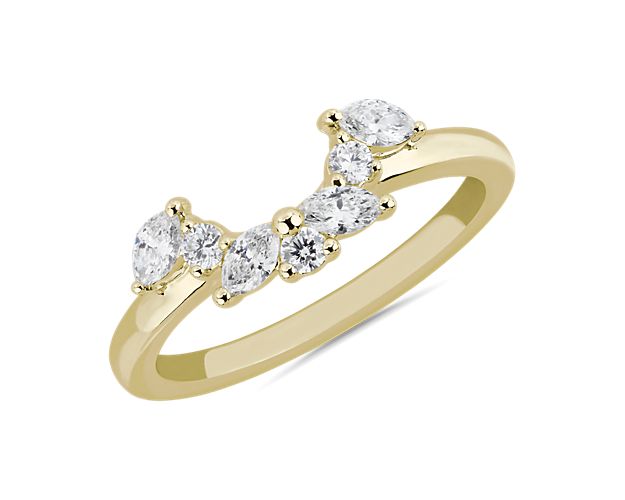 Alternating marquise and round-cut diamonds curve elegantly to form a semi-halo set in 14k yellow gold. This half circle of sparkle beautifully compliments your chosen engagemnt ring.