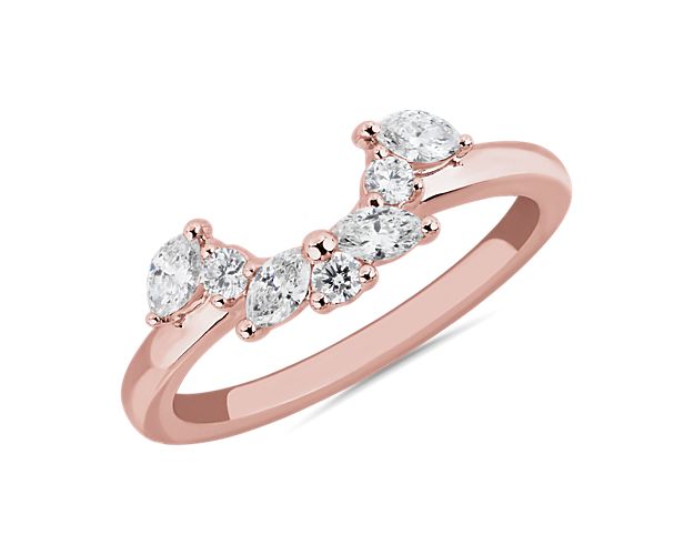 Alternating marquise and round-cut diamonds curve elegantly to form a semi-halo set in 14k rose gold. This half circle of sparkle beautifully compliments your chosen engagemnt ring.