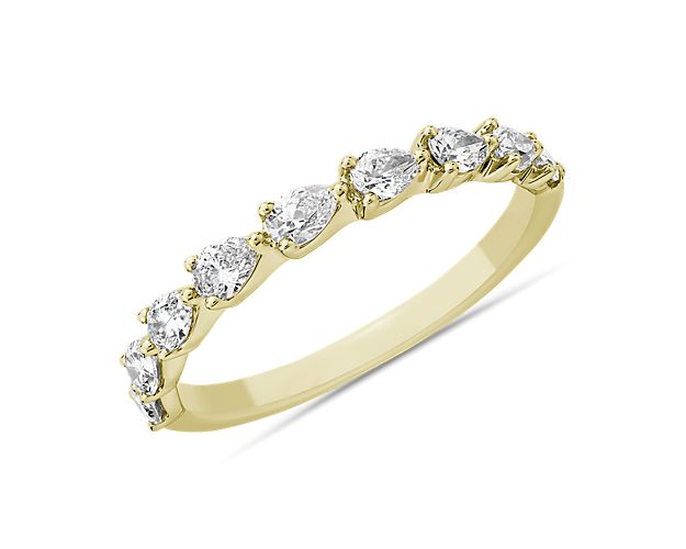Represent eternal love with this stunning anniversary band set with nine beautifully sparkling pear-cut diamonds. The warm gleam of the 14k yellow gold design gives it luxurious romance.