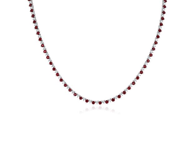 Stand out when you wear this eternity necklace crafted from 14k white gold and set with alternating larger red rubies and smaller shimmering diamonds. It is comfortably flexible and lies flat.