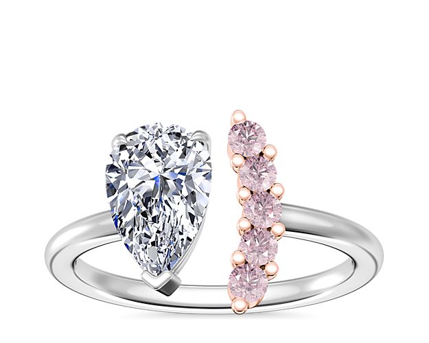 White gold engagement ring with a pear diamond and accent pink diamonds