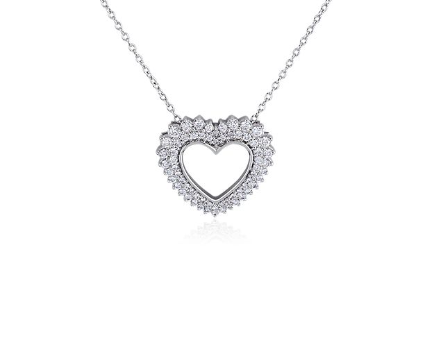 This heart-shaped pendant necklace features a hollow centre, with double rows of diamonds outlining the heart in a gorgeous burst style. The pendant and chain are crafted in 14k white gold, which promises a beautiful gleam.