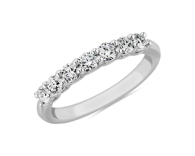 Go for timeless romance with this stunning ring featuring seven lab-grown diamonds shimmering along it. The 14k white gold low dome design gives it a comfortable feel on your hand.