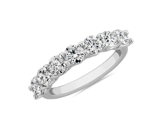 Promising gorgeous sparkle, this ring is set with seven shimmering lab-grown diamonds. It boasts a classic low dome design in 14k white gold for a look of timeless luxury and luster.