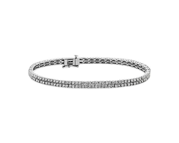 Add a touch of shimmer to your wrist with this timeless tennis bracelet featuring two rows of diamonds nestled next to each other for dramatic sparkle. The 14k white gold design ensures enduring quality and luxury.