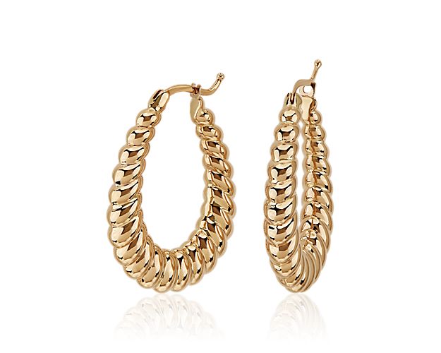 Set in 14k yellow gold, these graduated hoops feature a classic and stylish twisted pattern.