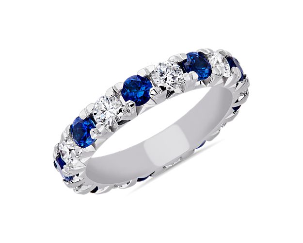 Stunning sapphires are punctuated by brilliant diamonds in this classic French pavé eternity band. Set in enduring platinum, this is the perfect gift for those who appreciate a pop of color.