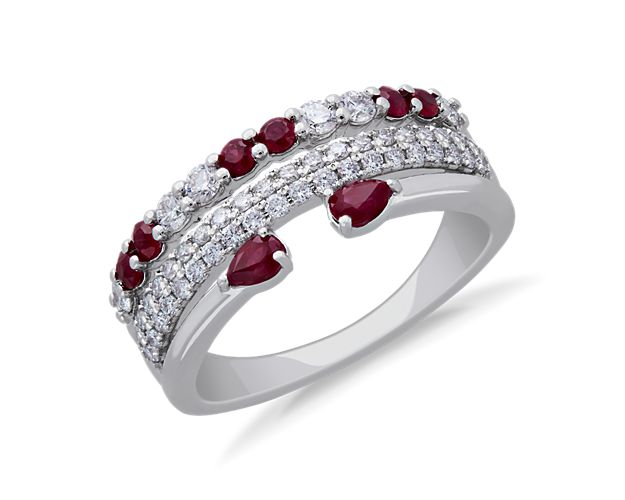 Sparkle as your hand catches the light when you're wearing this stunning ring featuring rows of brilliant diamonds and an open row finished with boldly red rubies. The gleam of the 14k white gold setting complements the stones beautifully.