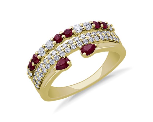 Sparkle as your hand catches the light when you're wearing this stunning ring featuring rows of brilliant diamonds and an open row finished with boldly red rubies. The gleam of the 14k yellow gold setting complements the stones beautifully.