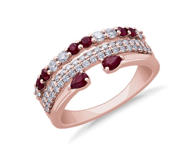 Sparkle as your hand catches the light when you're wearing this stunning ring featuring rows of brilliant diamonds and an open row finished with boldly red rubies. The gleam of the 14k rose gold setting complements the stones beautifully.
