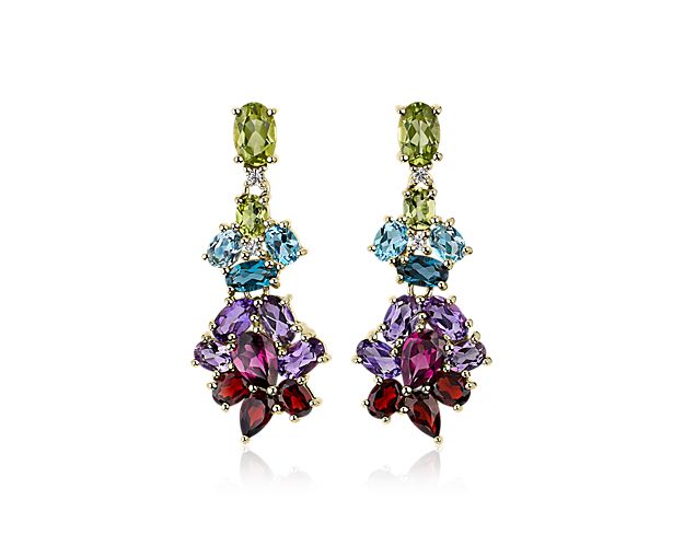 Pear-cut and oval-cut gemstones sparkle brilliantly with flashes of blue, purple and green in these mesmerizing chandelier earrings. They are designed in 14k yellow gold for a look of timeless luxury.
