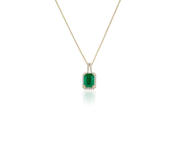 This classic emerald drop pendant is a sophisticated style that can be dressed up or down depending on the occasion. A halo of 34 round diamonds add extra sparkle.