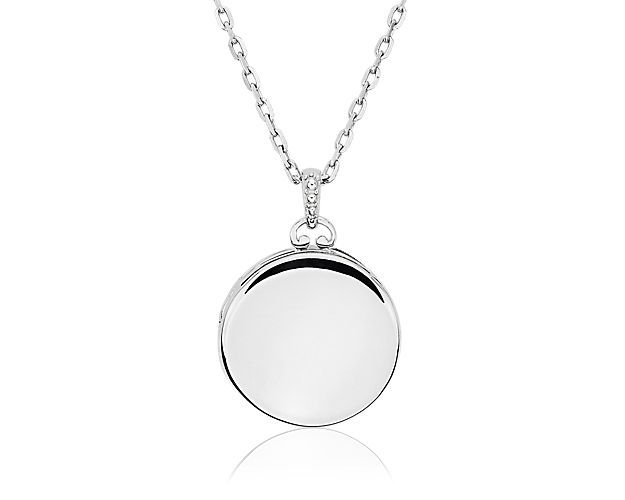 Carry your favorite memories close to your heart with this round picture locket. Crafted in bright sterling silver with sapphire detail, this substantial locket opens to reveal a photo inside. The locket hangs from a classic sterling silver 17" cable chain.