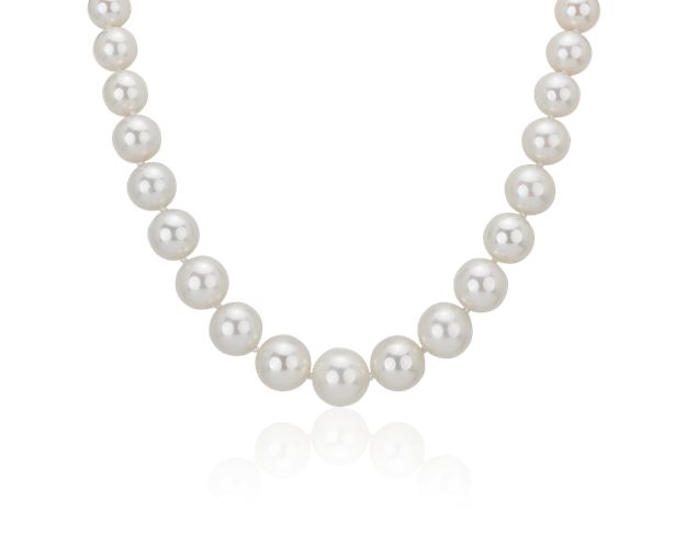 Graceful and luminous, this pearl necklace features 10-13mm South Sea cultured pearls that are graduated in size with a polished 18k white gold diamond encrusted clasp to complete the design.