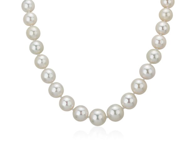 Graceful and luminous, this pearl necklace features 10-13mm South Sea cultured pearls that are graduated in size with a polished 18k white gold diamond encrusted clasp to complete the design.