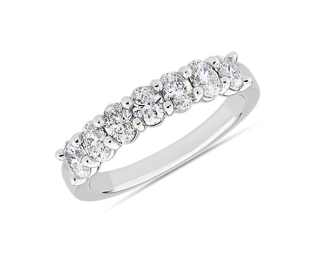The sun's rays radiate from every facet of seven brilliant oval-cut diamonds sending it in every direction across this timeless platinum ring.