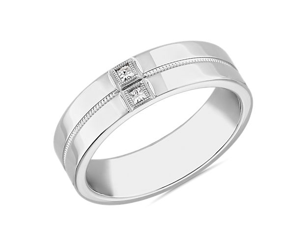 Sure to become the crown jewel of your ring stack, this platinum ring is centered by two princess-cut diamonds that hover on either side of a slim channel that splits the center of its modern design.