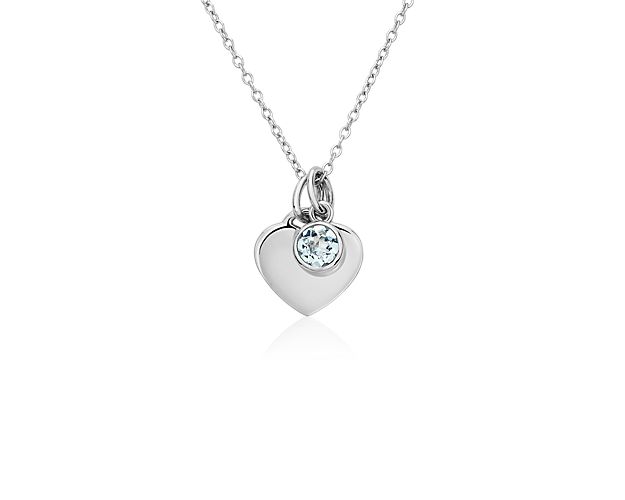 A cool blue, bezel-set aquamarine comes paired with a polished silver heart in this pretty pendant. The delicate charms are strung on a classic cable chain that can fasten at either 16 or 18 inches, making it a perfect layering piece.