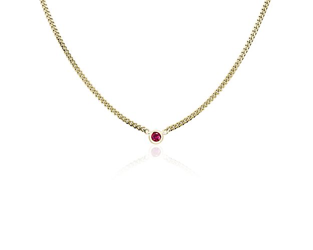 Crafted from gleaming 14k Italian yellow gold, this 18-inch-long curb link necklace exudes quiet luxury. A bezel ruby accent completes it with a flash of crimson allure.
