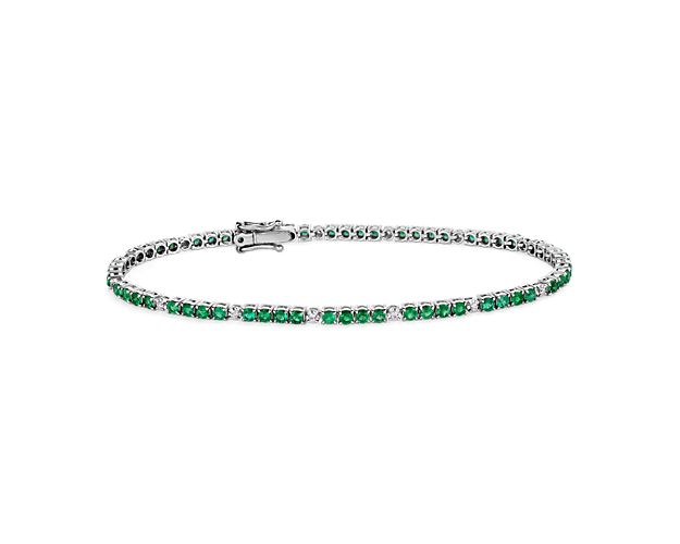 Everything you need to bring dazzling color to your look is here on this 14k white gold bracelet featuring quadruplets of emeralds interrupted by brilliant white diamonds.